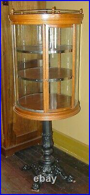 Rare antique round rotating oak display case w cast iron base-15732